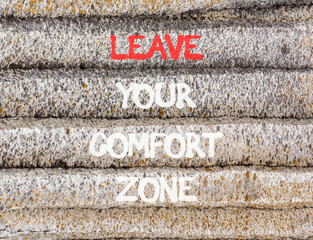 Leave your comfort zone symbol. Concept words Leave your comfort zone on beautiful grey stone wall. Beautiful stone wall background. Business psychological Leave your comfort zone concept. Copy space.