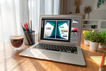 Graphic designer software for modern design of web page and commercial ads showing on the computer...