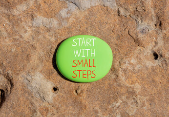 Start with small steps symbol. Concept words phrase Start with small steps on beautiful green...