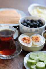 Turkish style breakfast: eggs, chechil cheese, white cheese, kashar cheese and Turkish tea