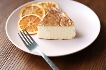 San Sebastian cheesecake on plate in restaurant in close-up	
