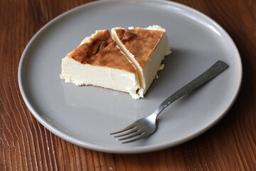 San Sebastian cheesecake on plate in restaurant in close-up	