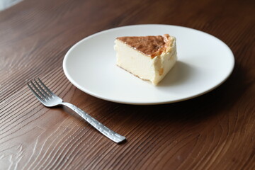 San Sebastian cheesecake on plate in restaurant in close-up	