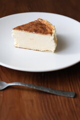 San Sebastian cheesecake on plate in restaurant in close-up	
