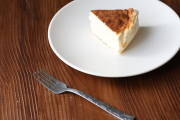 San Sebastian cheesecake on plate in restaurant in close-up	