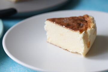 San Sebastian cheesecake on plate in restaurant in close-up	