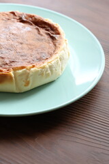 San Sebastian cheesecake on plate in restaurant in close-up	