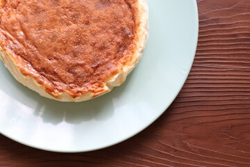 San Sebastian cheesecake on plate in restaurant in close-up	