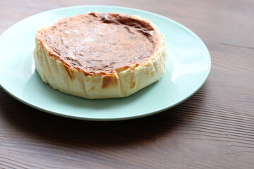 San Sebastian cheesecake on plate in restaurant in close-up	