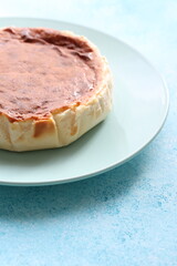 San Sebastian cheesecake on plate in restaurant in close-up	