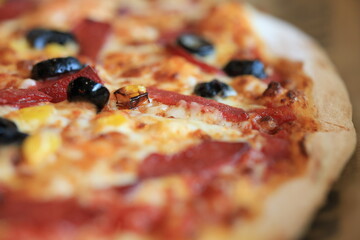 market pizza with salami and olives