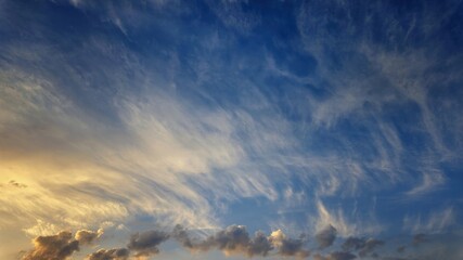 Colorful dawn sky with fluffy clouds