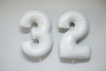 white foil numbers 32 with helium