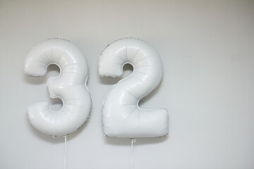 white foil numbers 32 with helium