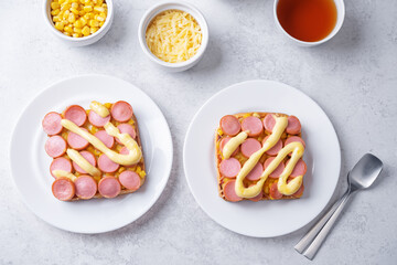 Cheese corn sausages baked sandwich in a plate