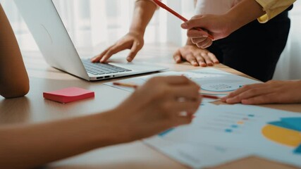 Startup company employee working together using laptop analyzing BI dashboard paper on financial data report and planning strategic marketing for creative business success in panorama video. Synergic - Powered by Adobe