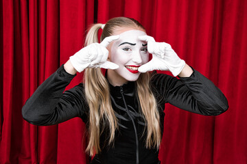 Portrait of a mime girl close-up, imitation of photo shooting