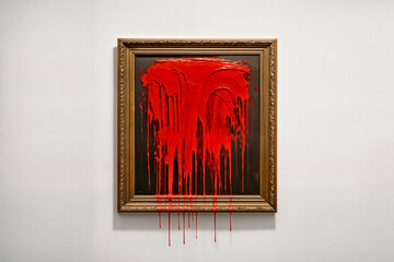 Vandalized Painting Hanging on White Wall with Red Paint Splashed on, Concept of Censorship Protest  and Freedom of Expression 