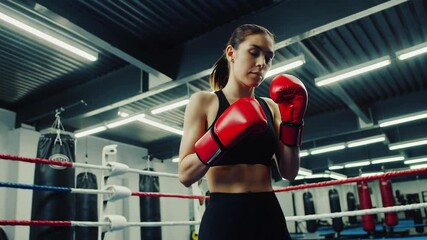 Confident woman athlete in boxing stance