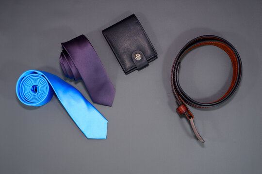 Men's fashion accessories together placed on dark background flat lay photography 