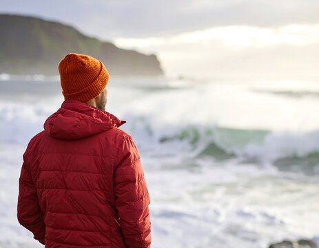 Man gazing at stormy sea