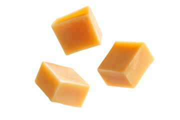 Three pieces of yellow cheese are shown on a white background