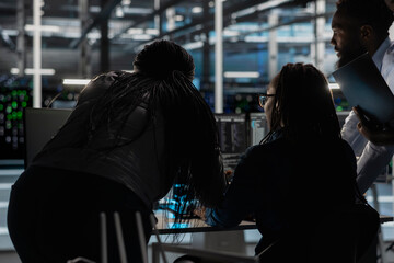 Server farm engineering team implementing and managing data backup solutions. Teamworking data...