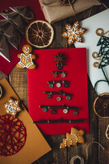 Handmade Christmas card with artisan buttons, wooden branches on craft recycled paper. Sustainable lifestyle, zero waste, children's gift. Family time, leisure activity, holiday recreation. Flat lay