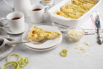 A slice of rhubarb pie on a white plate, Rhubarb Pie or Tart with sour cream filling . copy space.