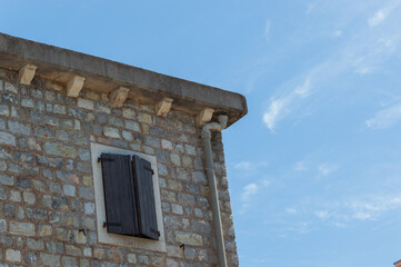 Old stone houses in Petrovac Montenegro, a resort town located on the coast of the Adriatic Sea in Montenegro