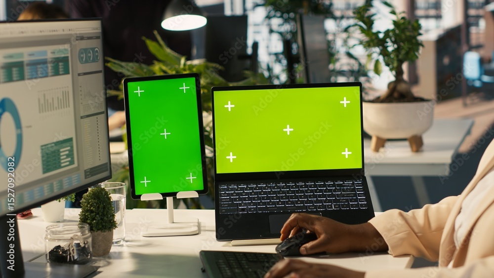 Poster mockup tablet and laptop in office used by employee working on company administrative tasks. chroma 