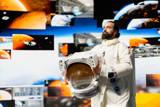 Space man on a cosmic journey mission surrounded by stars and the galaxy, showcasing surreal exploration. Male astronaut with suit and helmet travelling in the universe, outer space adventure.