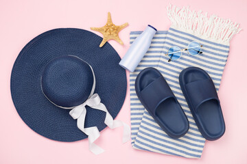 Blue beach accessories on color background, top view. Flat lay