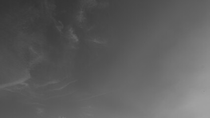 Dark, moody sky with indistinct cloud formations, suitable for abstract backgrounds, dramatic or...