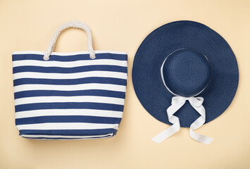 Blue beach accessories on color background, top view. Flat lay