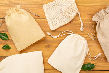 Small eco sack on wooden background, top view
