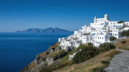 Whitewashed village nestled on a cliff overlooking the ocean.
