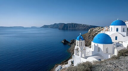 Whitewashed churches with blue domes overlooking a tranquil sea.