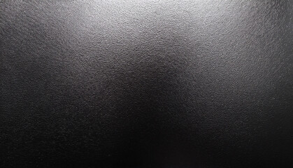 Close-up of a Rough, Black Textured Surface with Subtle Light and Shadow