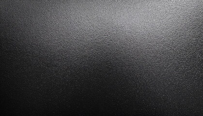 Close-up of a Rough, Black Textured Surface with Subtle Light and Shadow