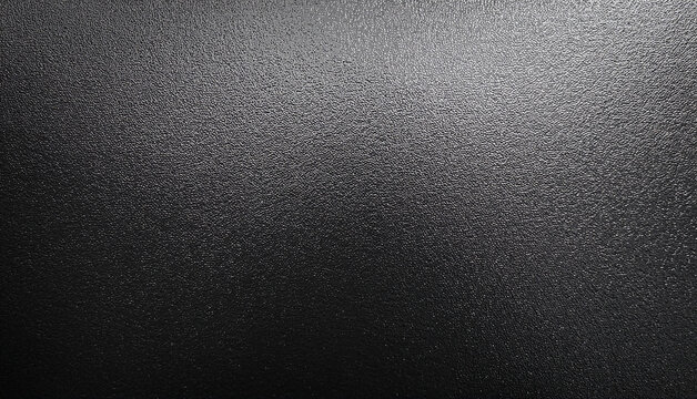 Close-up of a Rough, Black Textured Surface with Subtle Light and Shadow