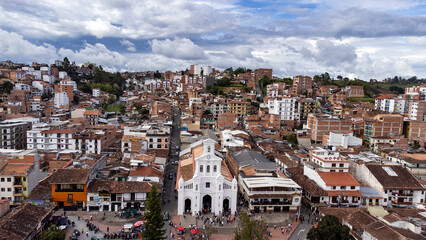 Fototapeta premium Marinilla, Antioquia, Colombia. June 1, 2025. Catholic parish located in the main park of the municipality