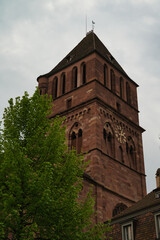 Naklejka premium The tower of the Church of Saint Thomas (Église Saint-Thomas) in Strasbourg, France. Protestant church 