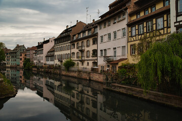 Fototapeta premium Romantic half-timbered houses from the 16th and 17th centuries, on the banks of the river III (tributary of the Rhine) in the center of Strasbourg, La petite France.