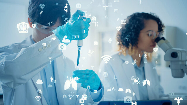 Multinational group of scientists conducting an experiment and medical technology concept