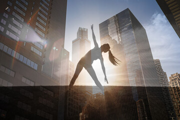 Silhouette of woman doing yoga stretching exercise outdoors against city sunset. body health balance concept 