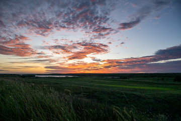 Clouds Catch Morning Light Over The Lush Kansas Prarie Below