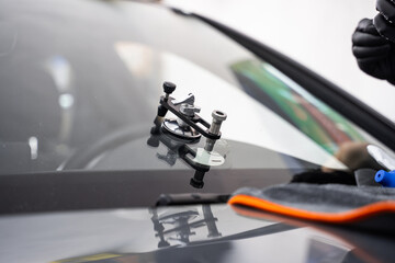 Bridge tool for injecting resin in damaged windshield. Accurate application improves durability and...