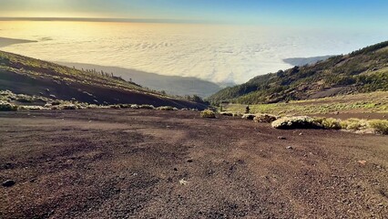 Experience the Stunning and Breathtaking View from a Volcanic Trail High Above the Clouds