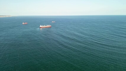A Stunning Aerial View of a Tranquil Seascape Featuring Ships and a Beautiful Coastline